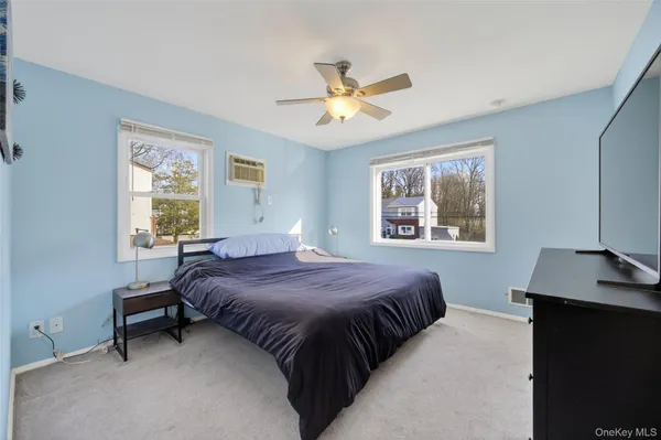 a view of room with furniture and wooden floor