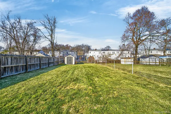 a view of a yard with a large trees