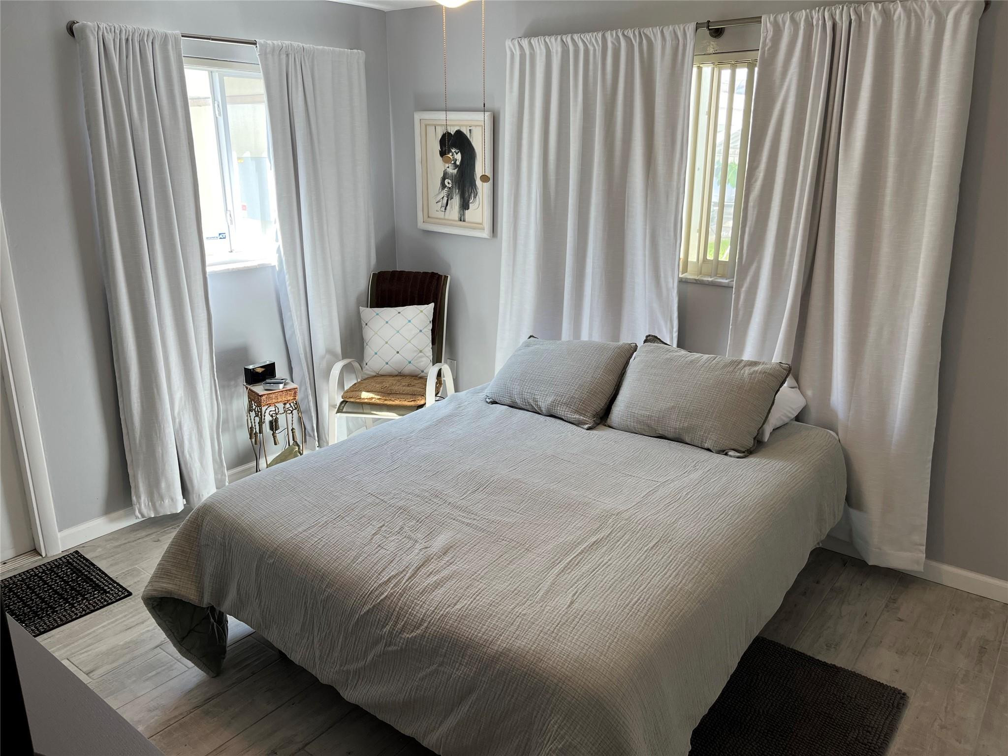 412 South Luna Court, Unit 2 Hollywood, FL 33021 - Photo 12 of 20 a bedroom with a bed and a window