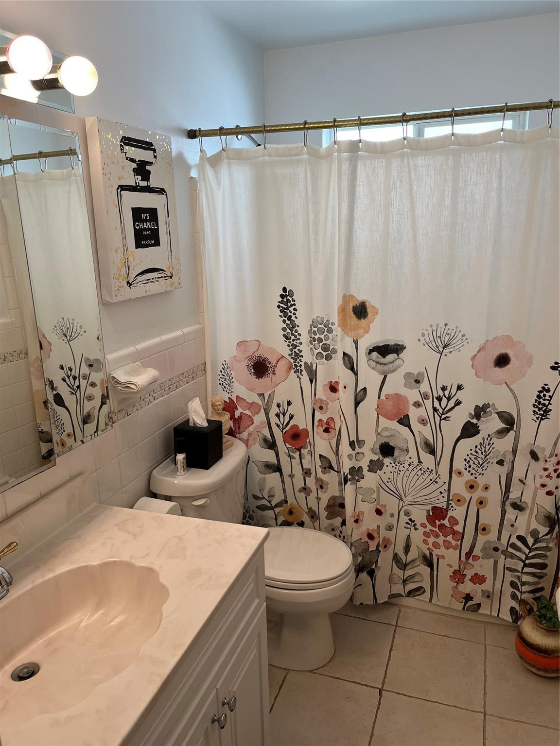 412 South Luna Court, Unit 2 Hollywood, FL 33021 - Photo 13 of 20 a bathroom with a toilet sink and mirror