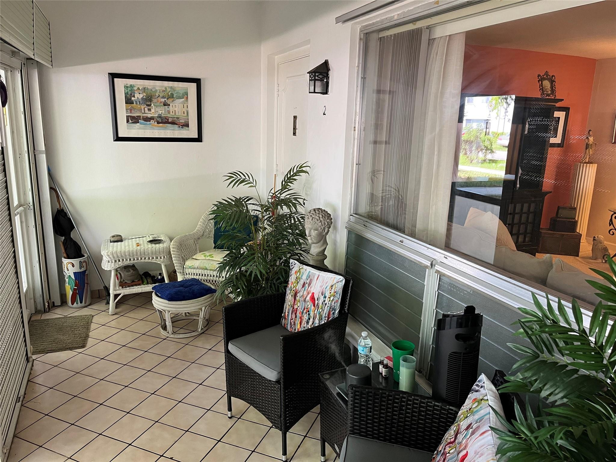 412 South Luna Court, Unit 2 Hollywood, FL 33021 - Photo 20 of 20 a living room with furniture and a potted plant