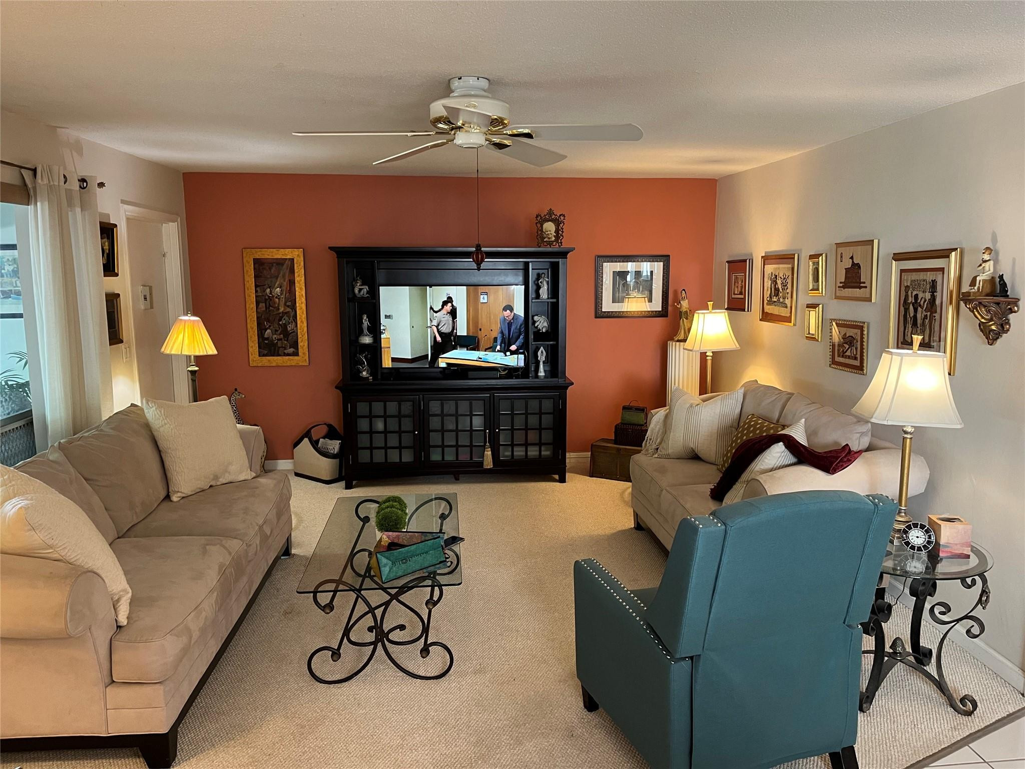412 South Luna Court, Unit 2 Hollywood, FL 33021 - Photo 4 of 20 a living room with furniture and a flat screen tv