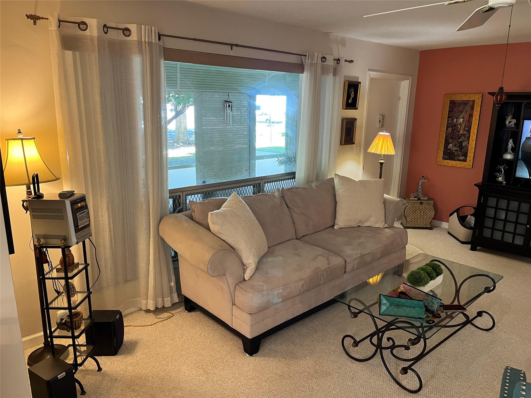 412 South Luna Court, Unit 2 Hollywood, FL 33021 - Photo 5 of 20 a living room with furniture and a flat screen tv