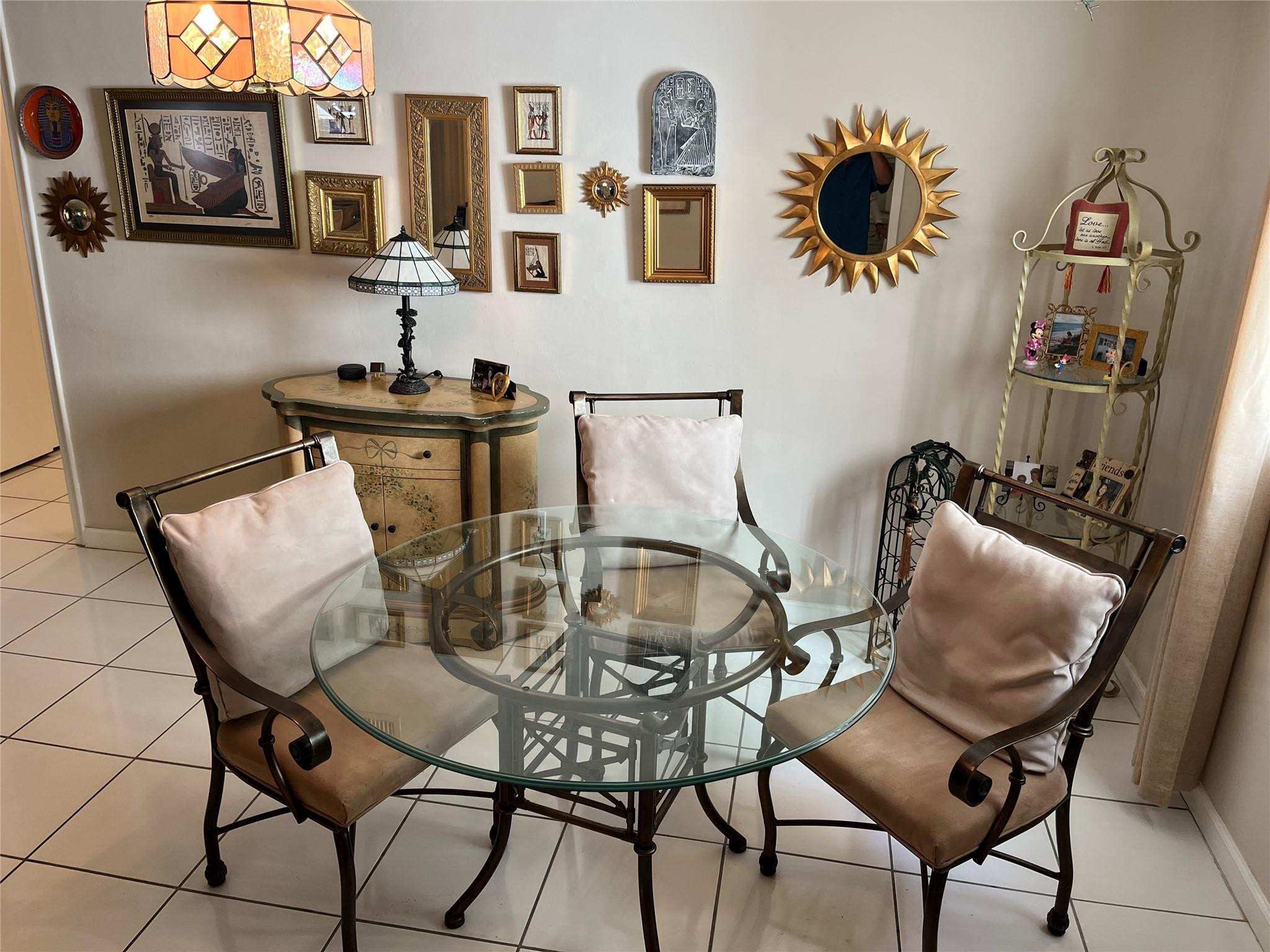 412 South Luna Court, Unit 2 Hollywood, FL 33021 - Photo 7 of 20 a dining room with furniture and wooden floor