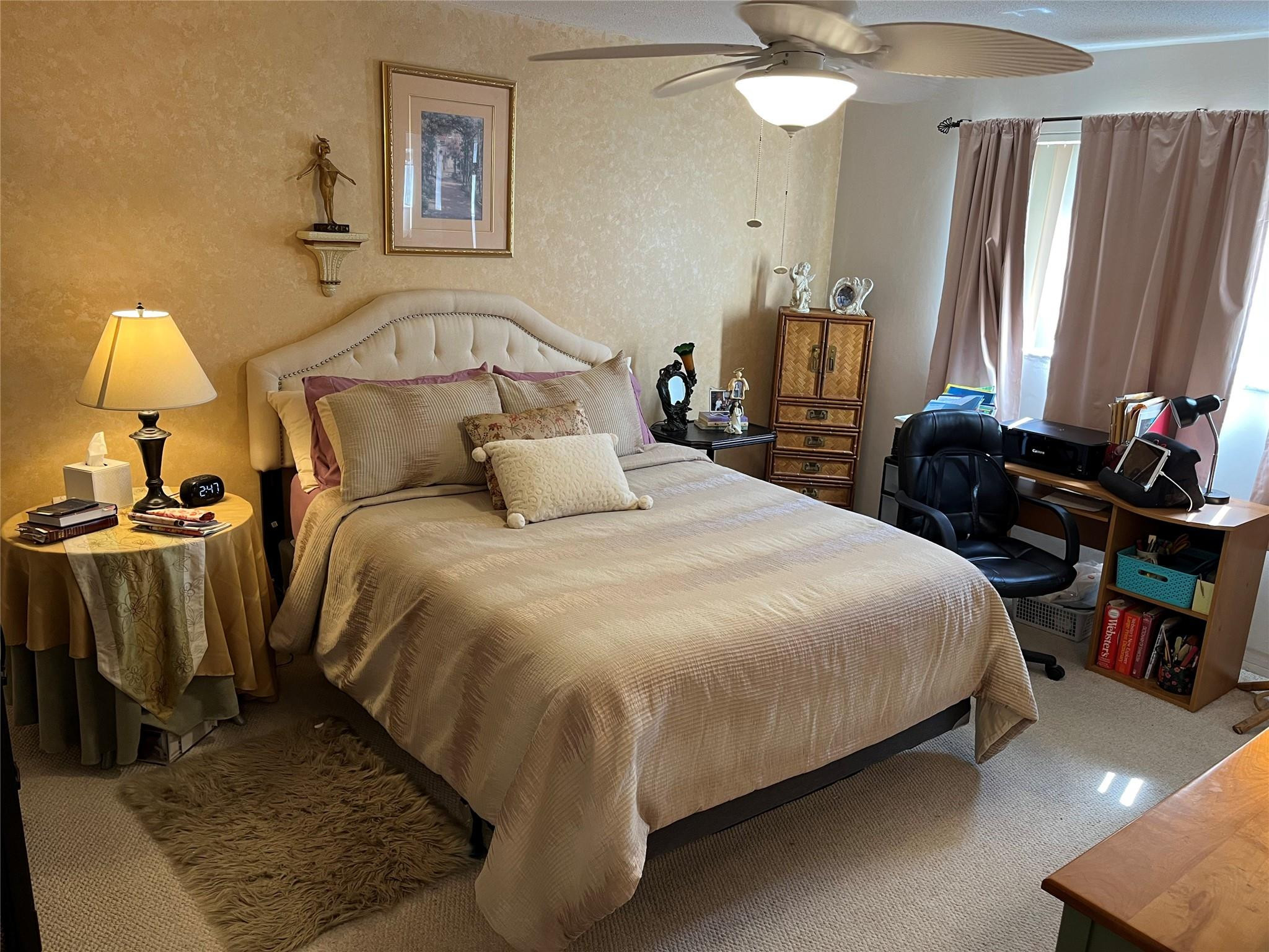 412 South Luna Court, Unit 2 Hollywood, FL 33021 - Photo 8 of 20 a bedroom with a bed and a chandelier