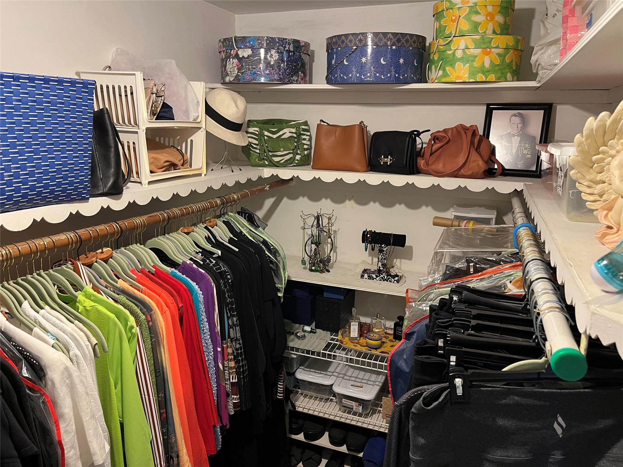 412 South Luna Court, Unit 2 Hollywood, FL 33021 - Photo 10 of 20 a view of walk in closet with clothes and shoes