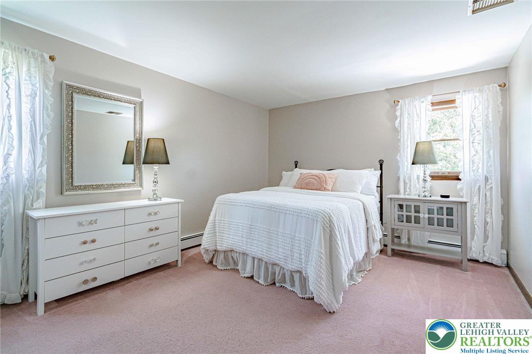 3857 Friedens Road Slatington, PA 18080 - Photo 43 of 75 This cozy bedroom features soft tones and ample natural light, creating a serene personal retreat.