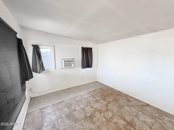 a large white bed in a white room