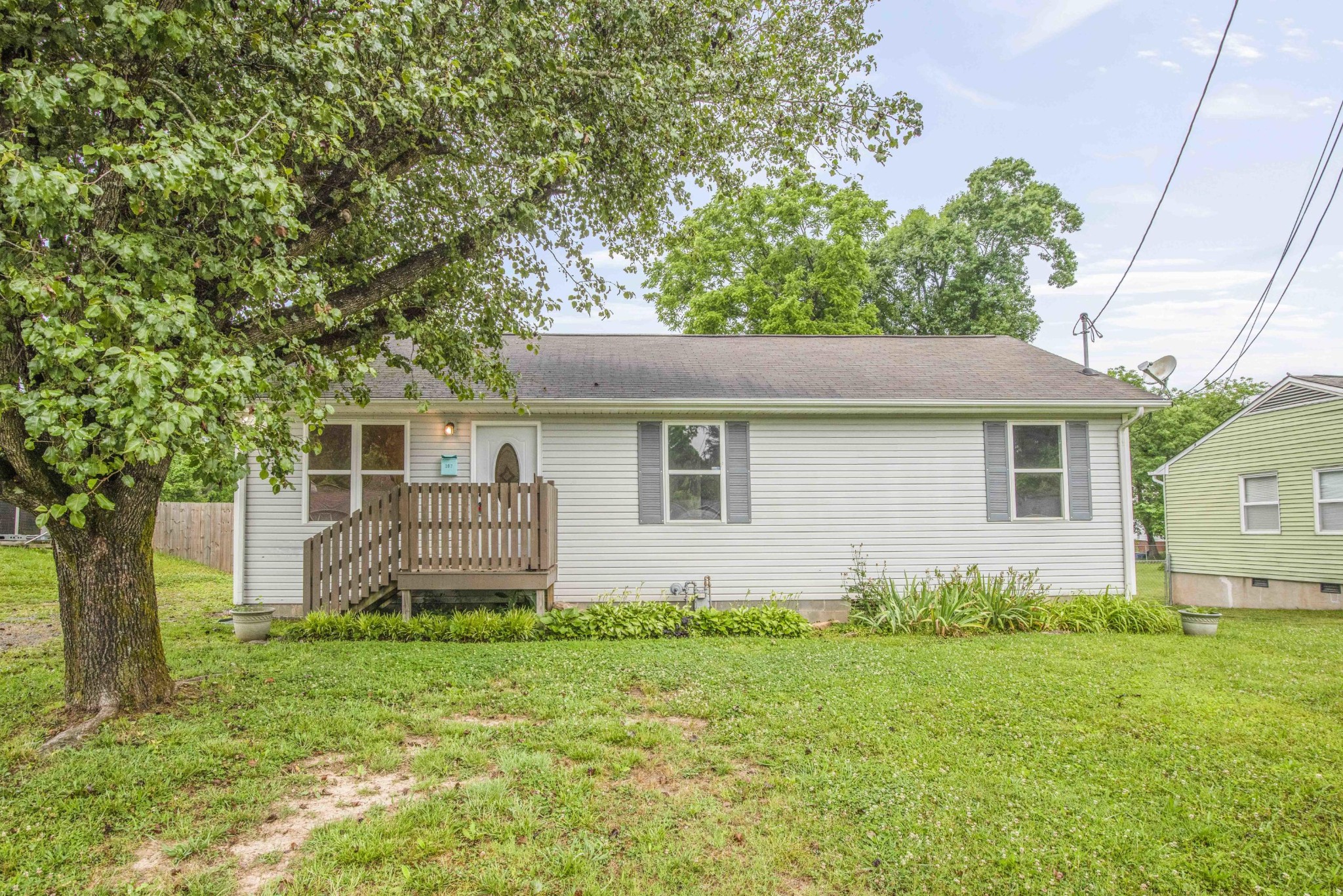 107 East Arrowwood Road Oak Ridge, TN 37830 - Photo 1 of 25 a front view of a house with garden