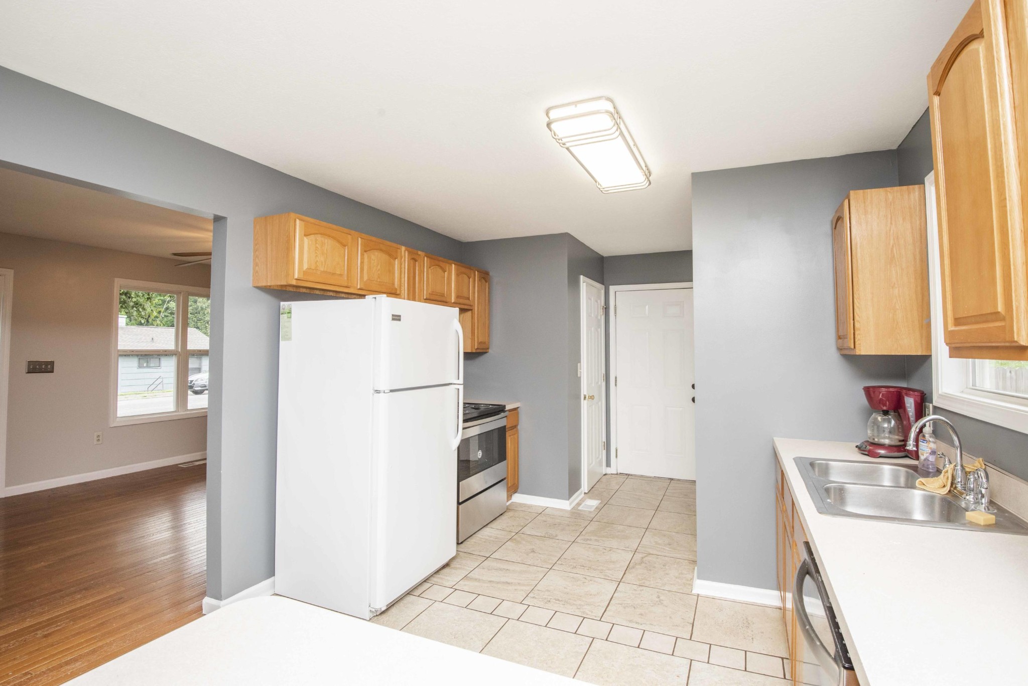 107 East Arrowwood Road Oak Ridge, TN 37830 - Photo 15 of 25 a kitchen with a refrigerator sink and cabinets