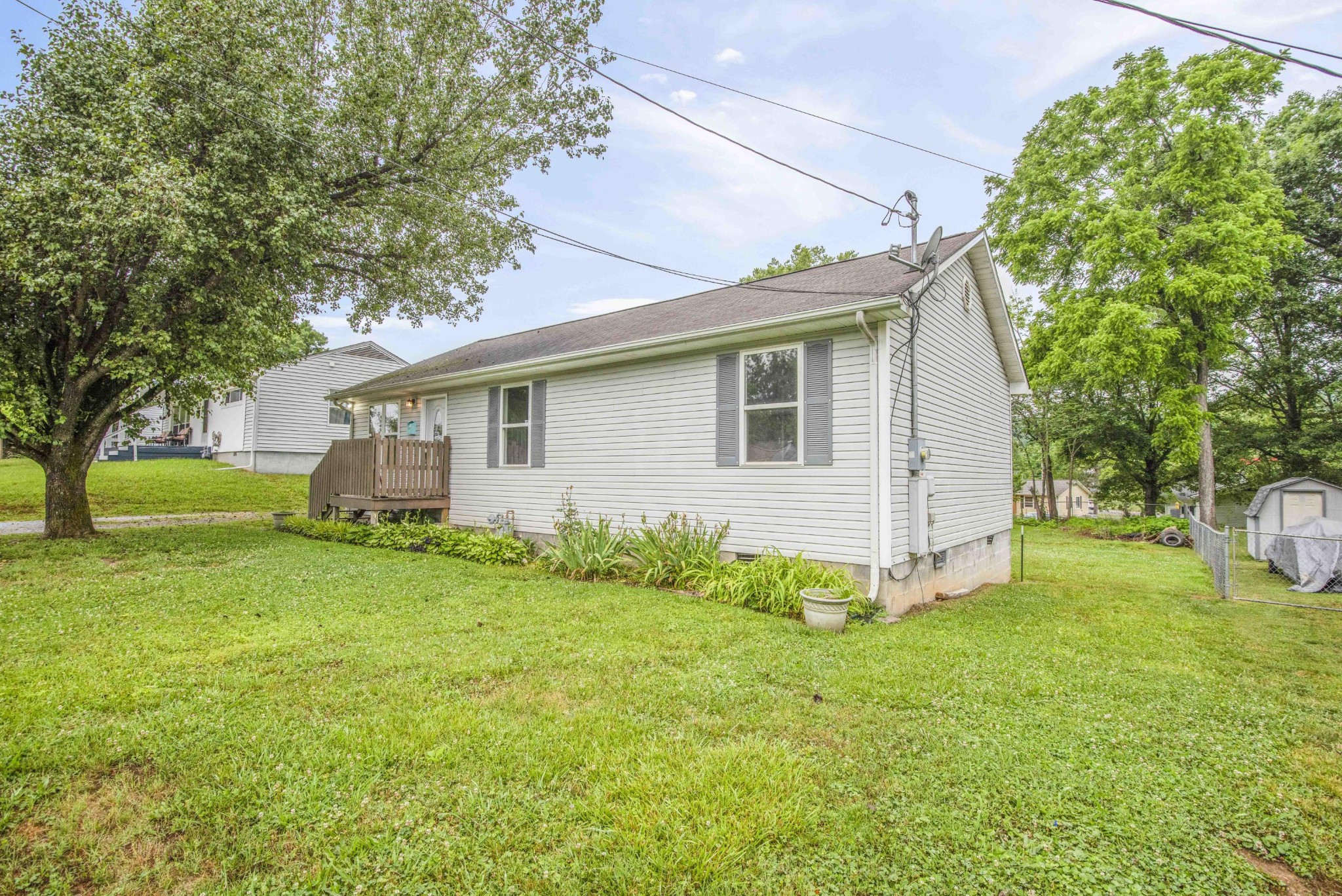 107 East Arrowwood Road Oak Ridge, TN 37830 - Photo 2 of 25 a view of a backyard with a garden