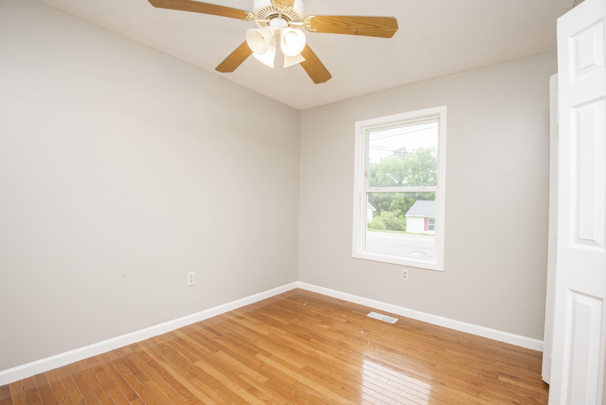 107 East Arrowwood Road Oak Ridge, TN 37830 - Photo 22 of 25 an empty room with a window and a fan