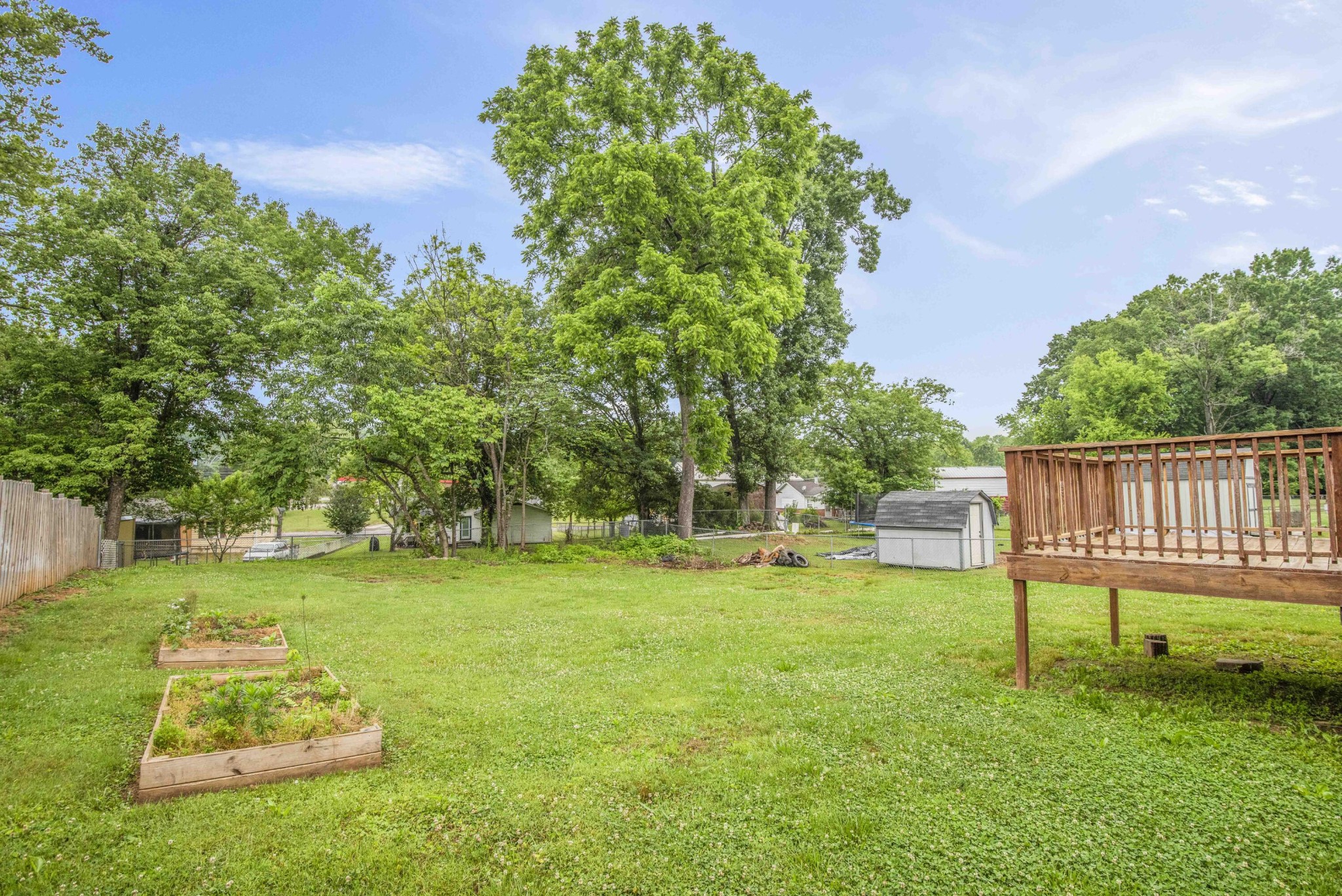 107 East Arrowwood Road Oak Ridge, TN 37830 - Photo 4 of 25 a backyard of a house with table and chairs