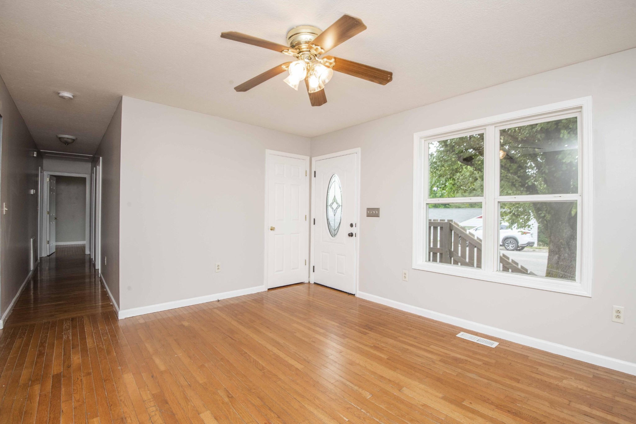 107 East Arrowwood Road Oak Ridge, TN 37830 - Photo 6 of 25 a view of empty room with wooden floor and fan