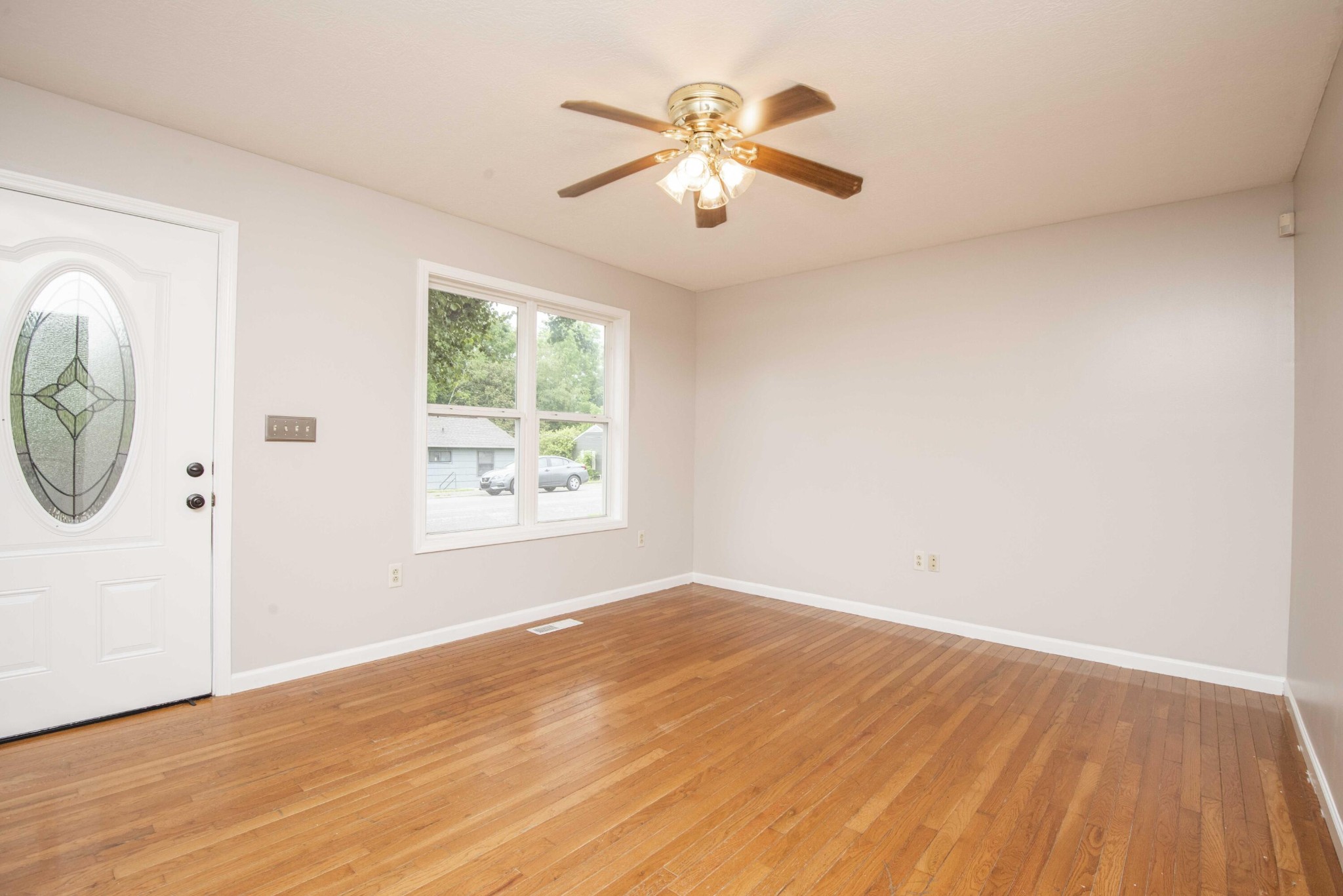 107 East Arrowwood Road Oak Ridge, TN 37830 - Photo 7 of 25 wooden floor in an empty room with a window