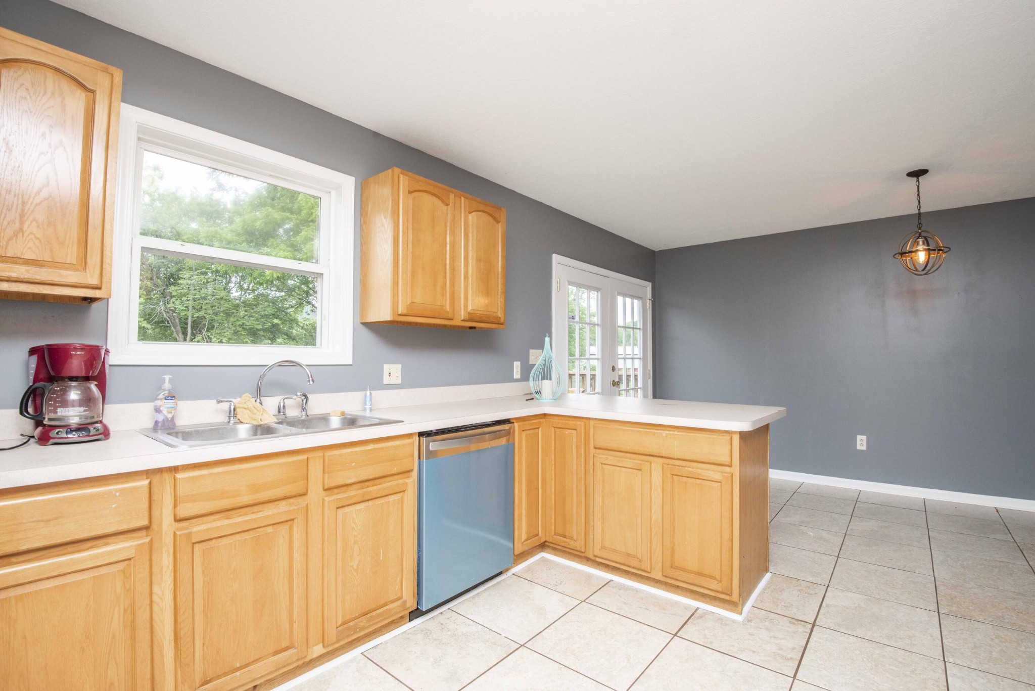 107 East Arrowwood Road Oak Ridge, TN 37830 - Photo 10 of 25 a kitchen with a sink cabinets and window