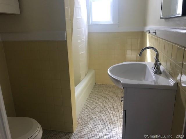 19 Greenfield Avenue Ridgefield, CT 06877 - Photo 24 of 28 a bathroom with a sink and a toilet