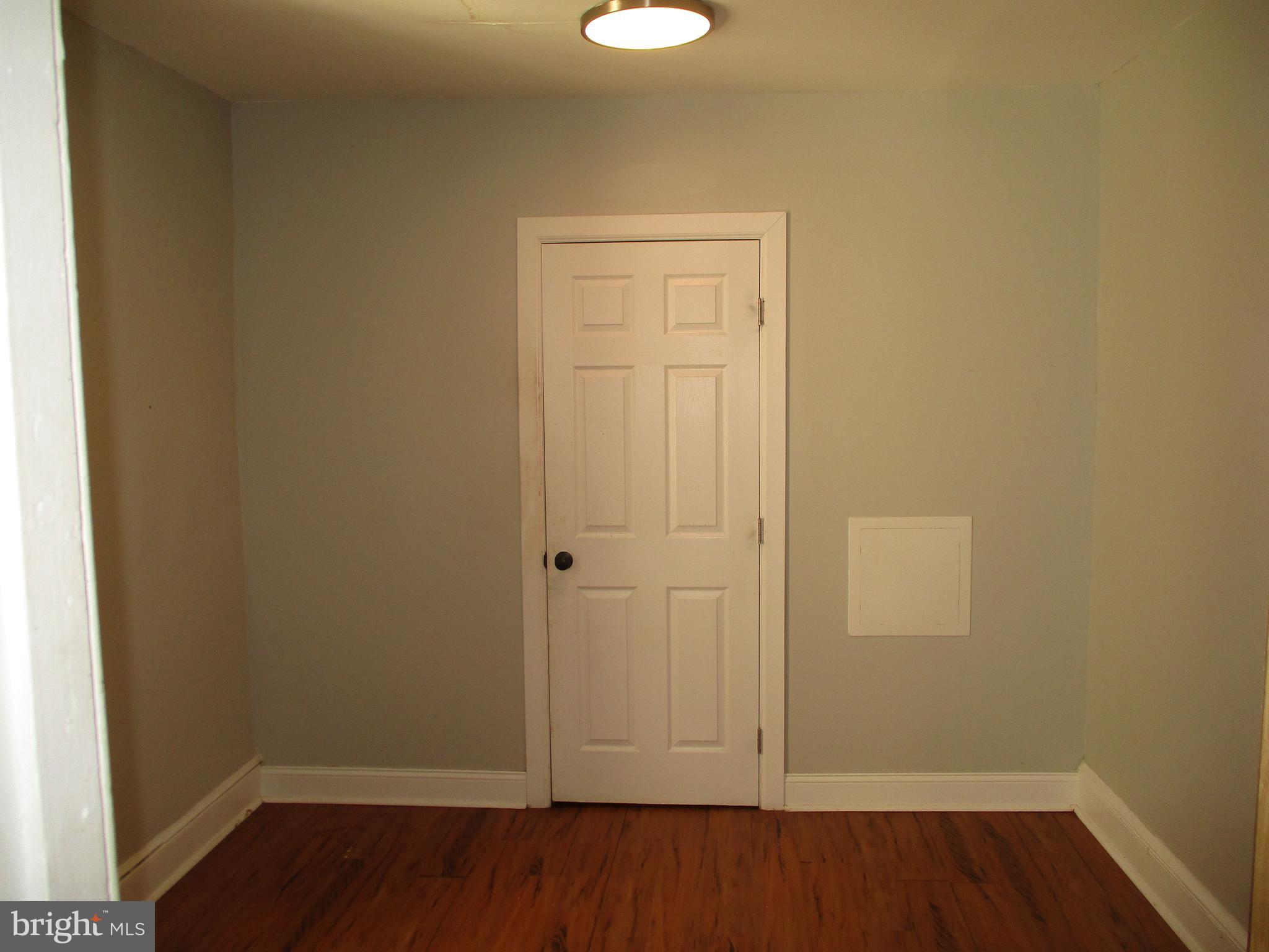 1242 Muhlenberg Street Reading, PA 19602 - Photo 11 of 18 wooden floor in an empty room