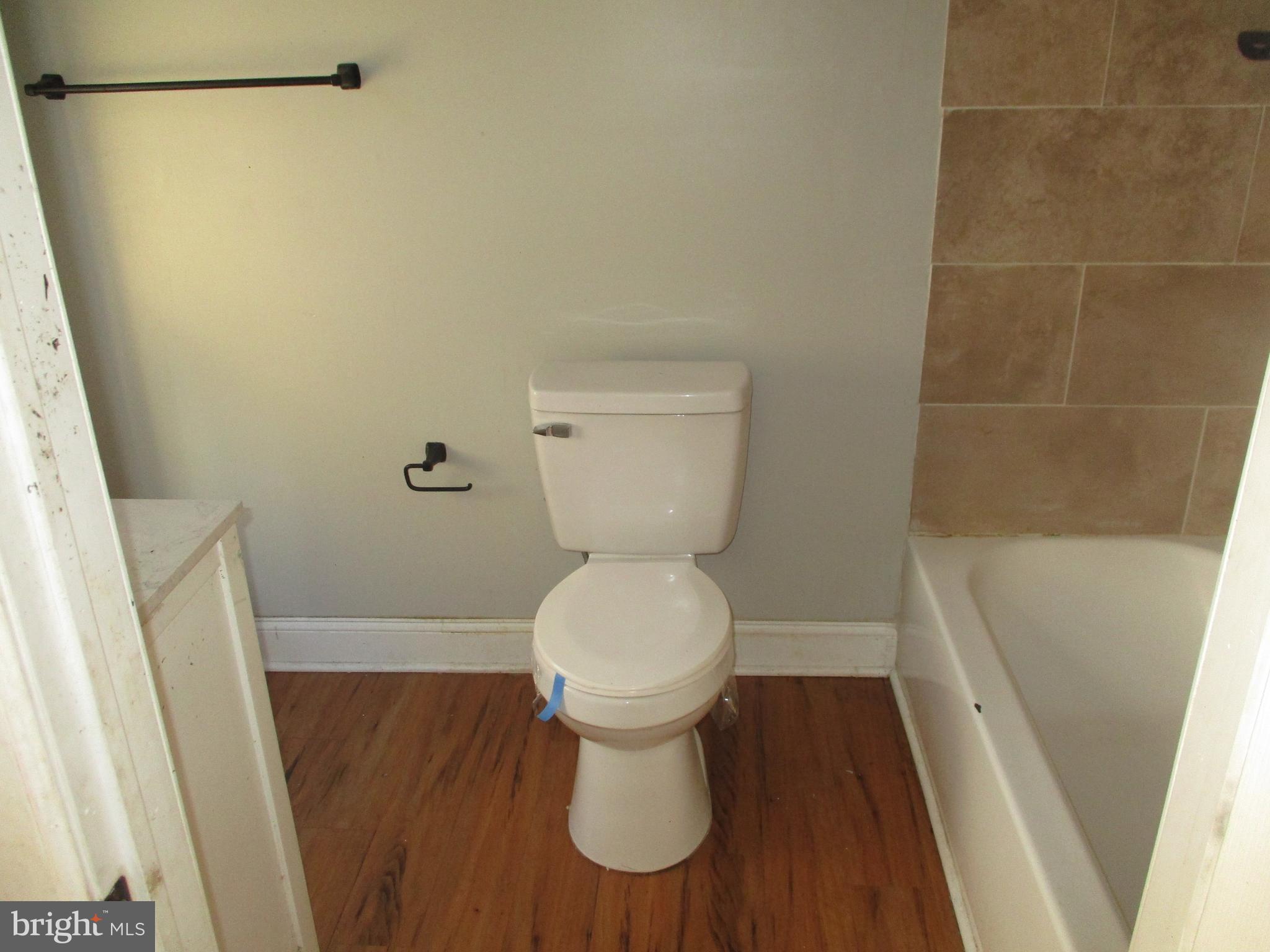 1242 Muhlenberg Street Reading, PA 19602 - Photo 12 of 18 a bathroom with a toilet and a sink