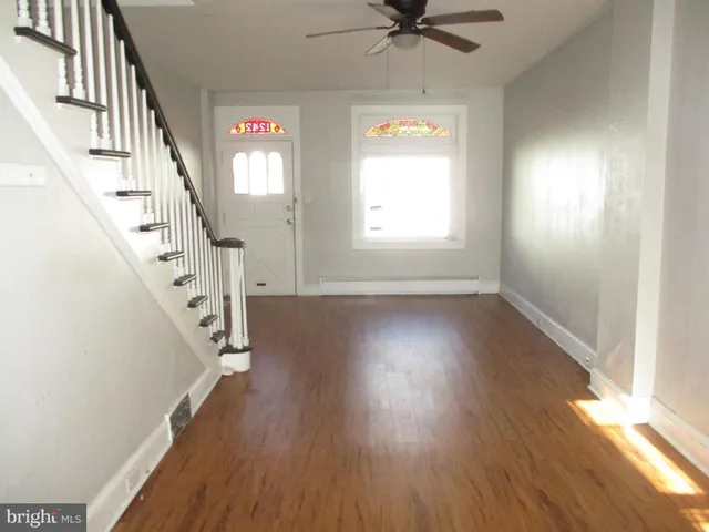 a view of entryway with wooden floor