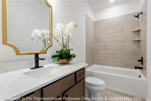 a bathroom with a sink a toilet and a bathtub