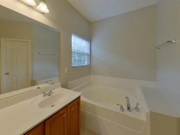 a bathroom with a bathtub and a sink