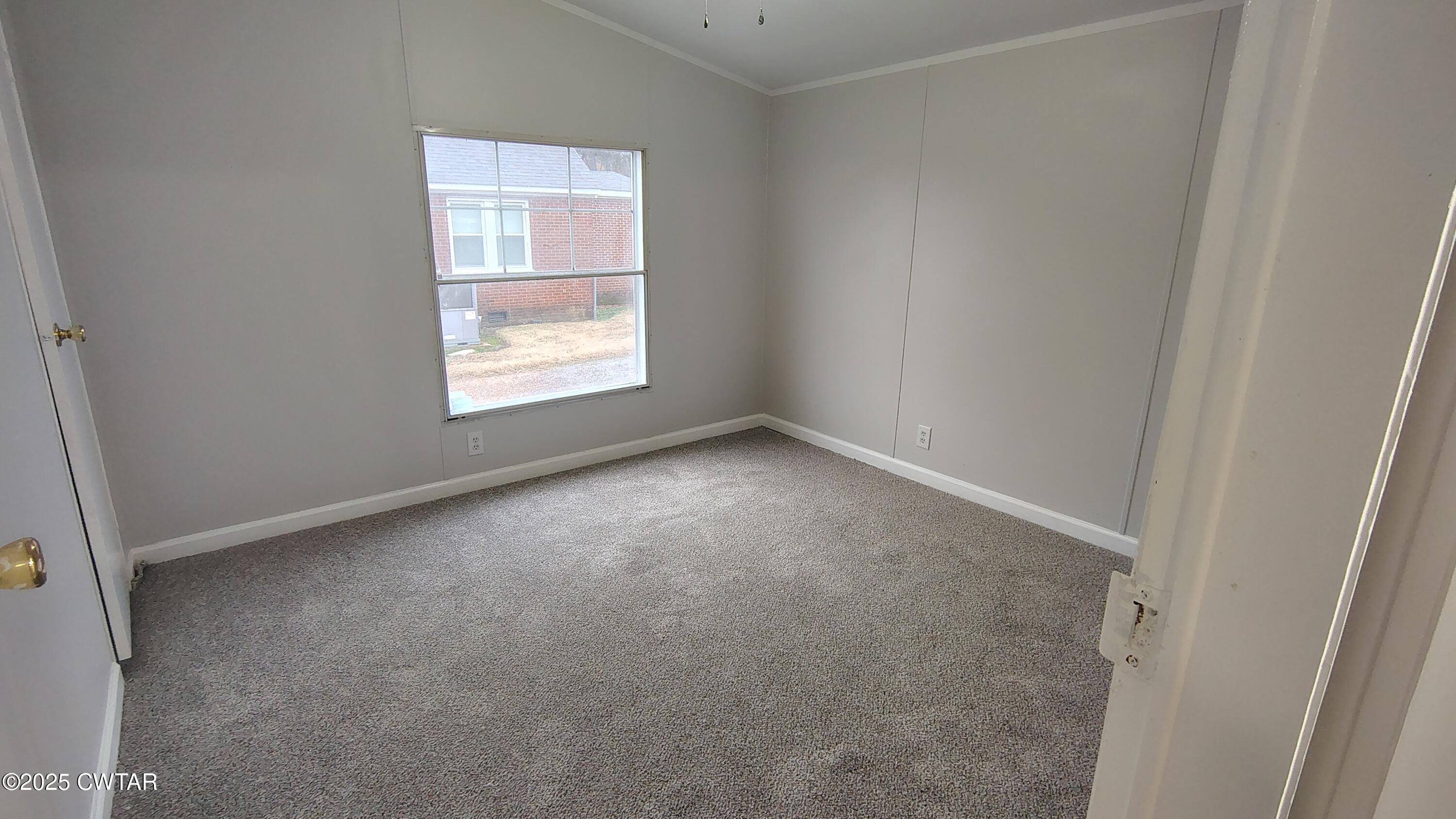 420 South Main Street Ridgely, TN 38080 - Photo 9 of 13 an empty room with a window