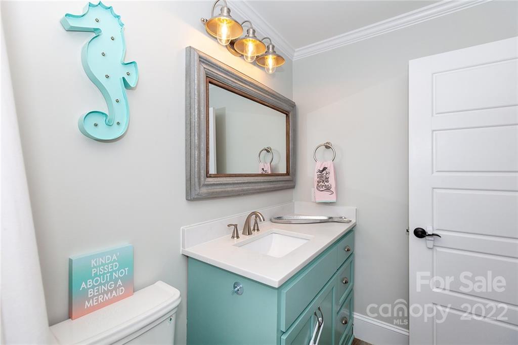 4301 Eagle Lake Drive Charlotte, NC 28217 - Photo 16 of 41 a bathroom with a sink mirror vanity and toilet