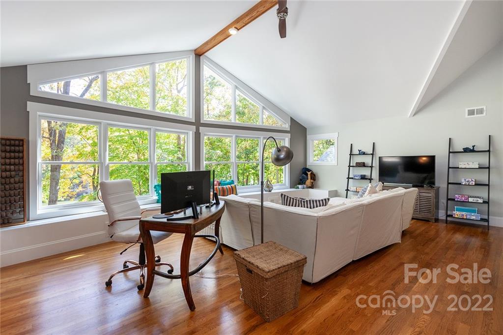 4301 Eagle Lake Drive Charlotte, NC 28217 - Photo 27 of 41 a living room with fireplace furniture and a large window