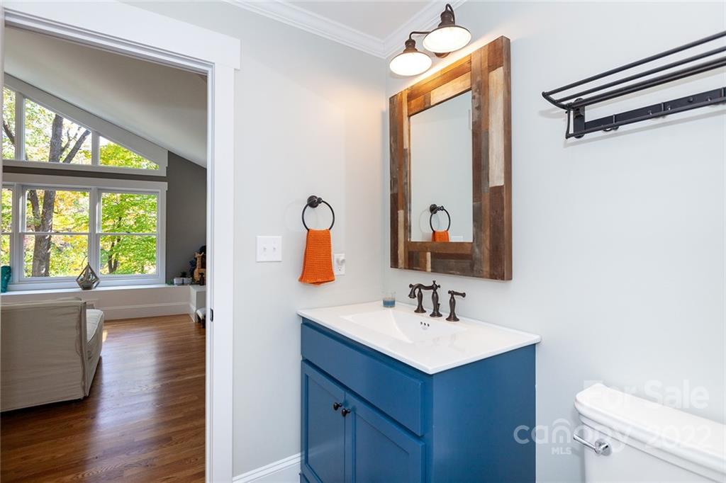 4301 Eagle Lake Drive Charlotte, NC 28217 - Photo 31 of 41 a bathroom with a sink mirror vanity and a toilet