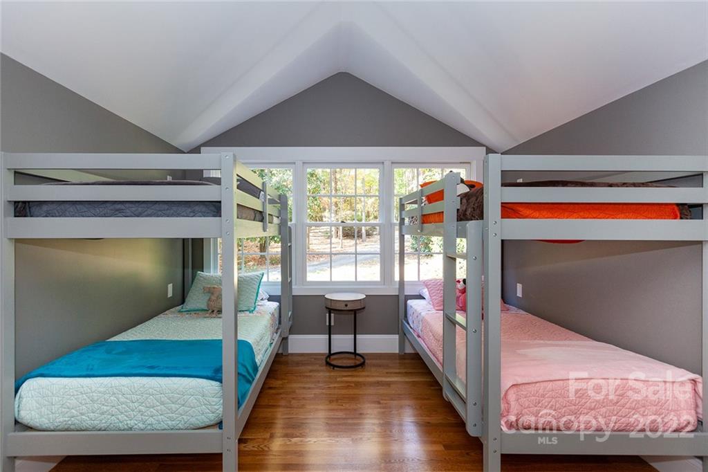 4301 Eagle Lake Drive Charlotte, NC 28217 - Photo 32 of 41 a living room with hardwood floor pool table and a fireplace