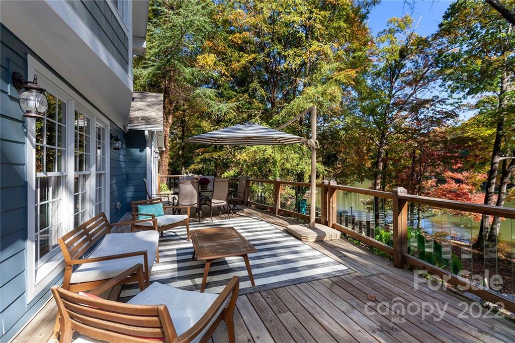 4301 Eagle Lake Drive Charlotte, NC 28217 - Photo 34 of 41 a view of a patio with couches table and chairs with wooden floor and fence