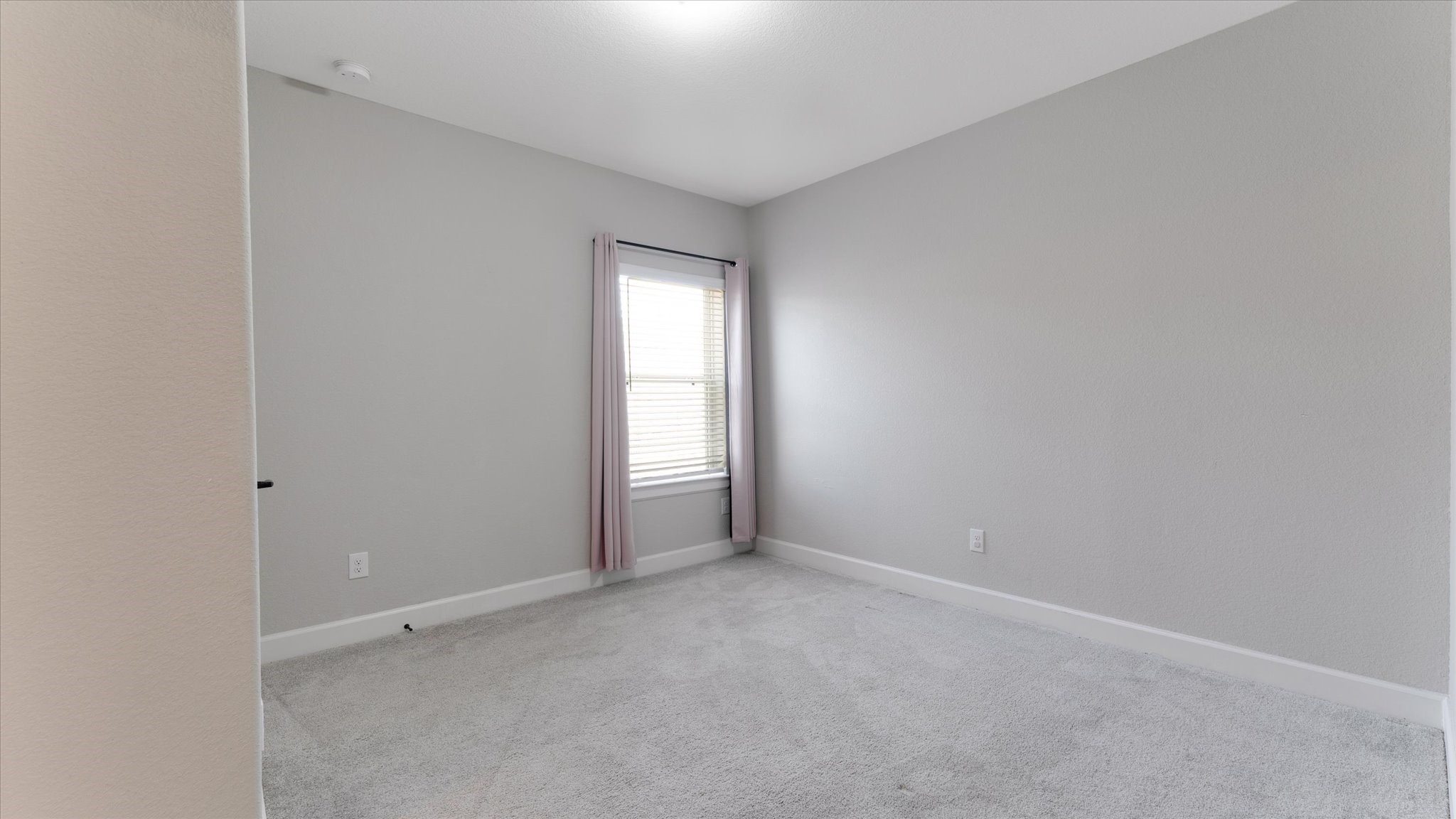 15607 Rising Wren Court Conroe, TX 77302 - Photo 28 of 40 a view of an empty room and a window
