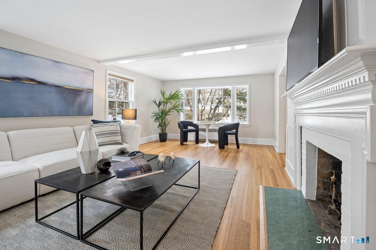1091 Round Hill Road Fairfield, CT 06824 - Photo 11 of 28 a living room with furniture and a fireplace
