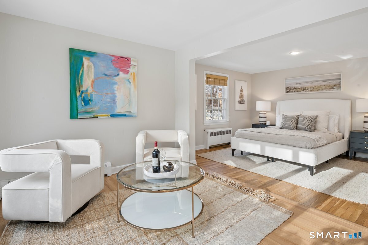 1091 Round Hill Road Fairfield, CT 06824 - Photo 20 of 28 a living room with furniture and a table