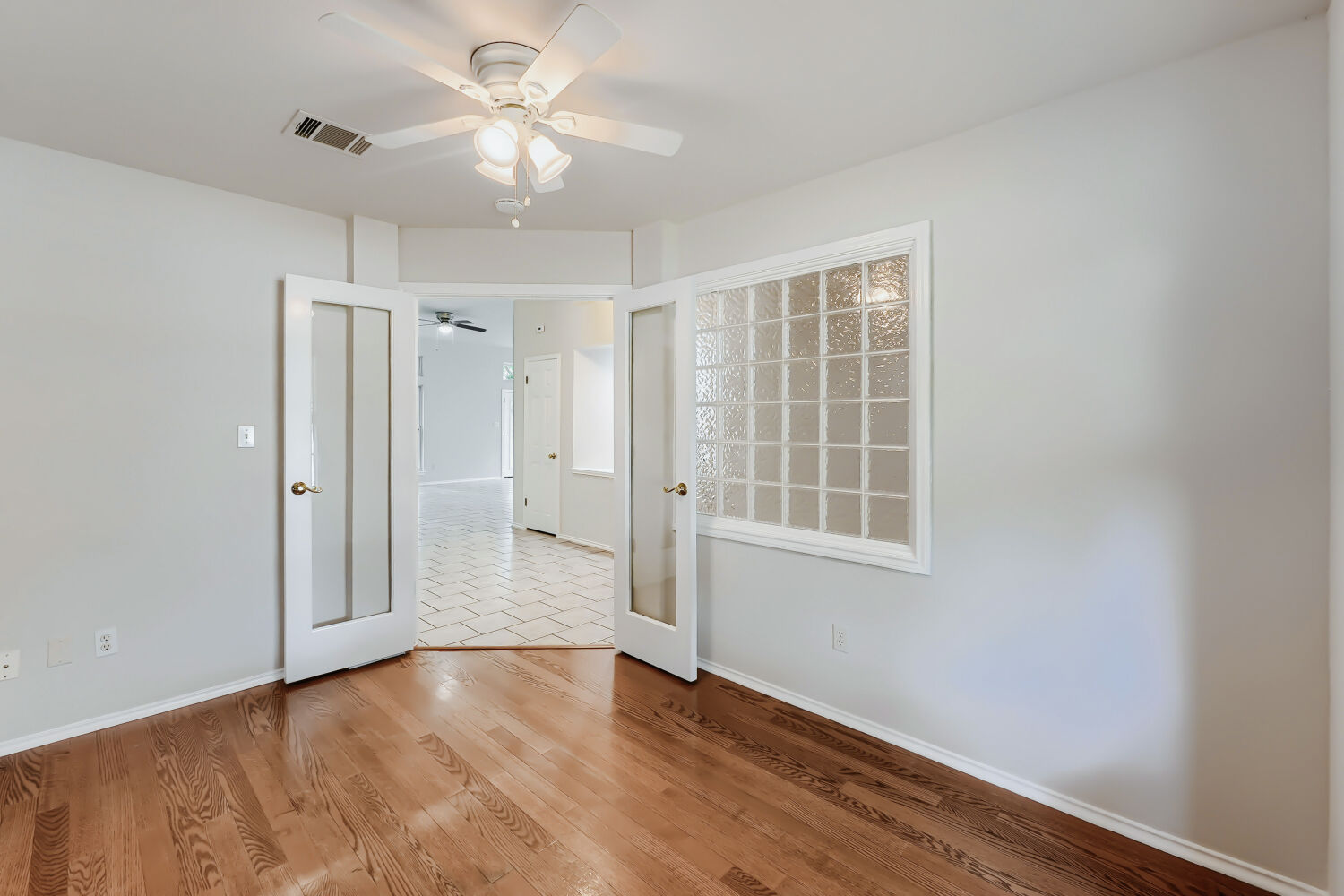 119 Stephen Lane Georgetown, TX 78626 - Photo 4 of 32 A dedicated office creates space between business and fun. French doors, rich wood floors and window overlooking front yard make this space ideal for the work from home professional, writer, artist...