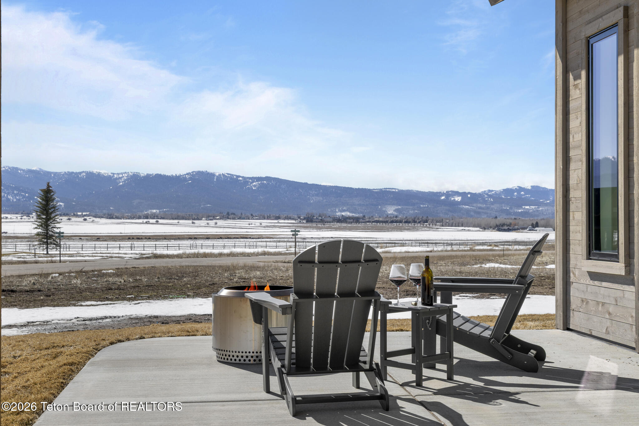 6373 Snow Goose Circle Victor, ID 83455 - Photo 54 of 59 46 Patio chair fire looking south close