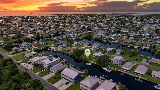 an aerial view of residential houses with city view