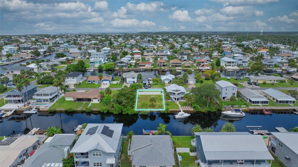 Centavo Court Brooksville, FL 34607 - Photo 6 of 10 an aerial view of residential houses with outdoor space