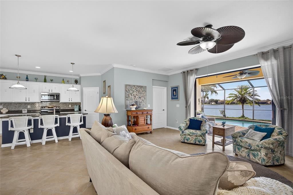2877 Via Piazza Loop Fort Myers, FL 33905 - Photo 11 of 39 a living room with furniture and a large window