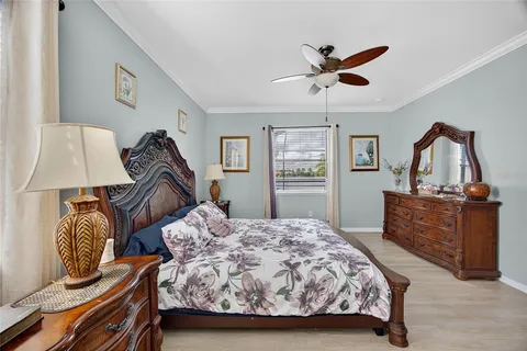 a bedroom with two beds and a dresser