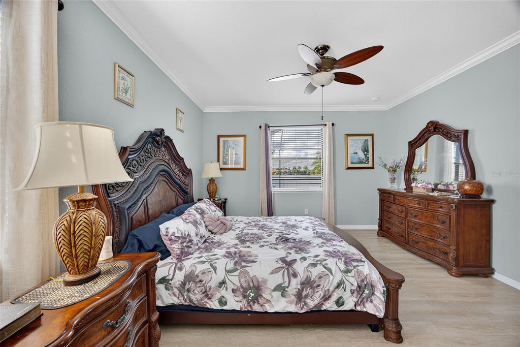 2877 Via Piazza Loop Fort Myers, FL 33905 - Photo 17 of 39 a bedroom with two beds and a dresser