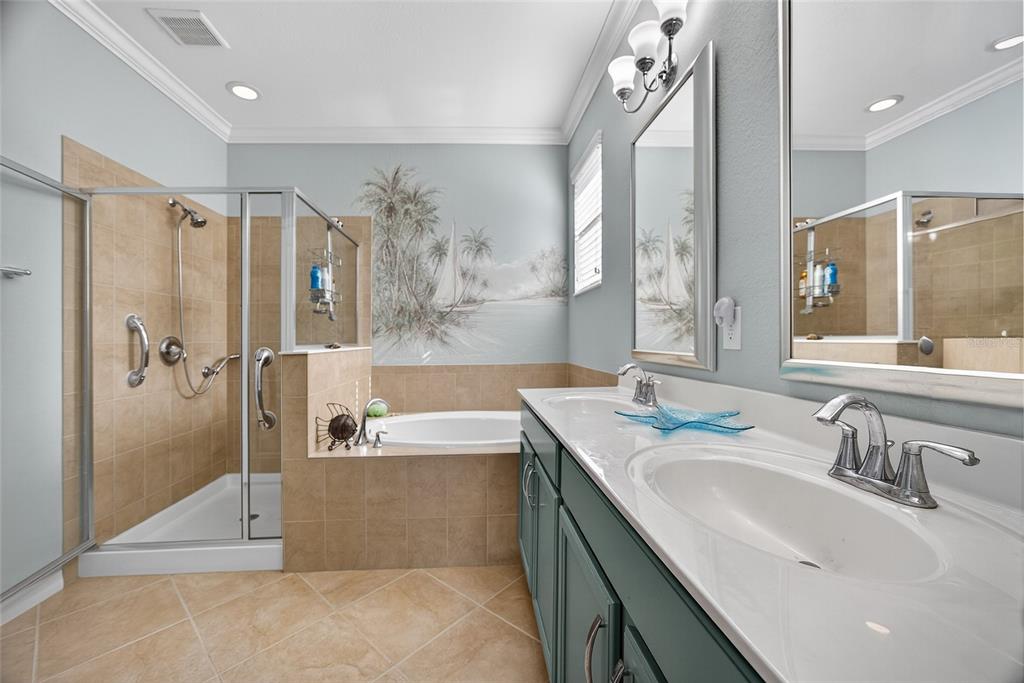 2877 Via Piazza Loop Fort Myers, FL 33905 - Photo 18 of 39 a bathroom with a tub sink and mirror