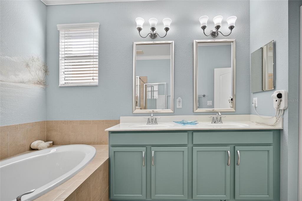 2877 Via Piazza Loop Fort Myers, FL 33905 - Photo 19 of 39 a bathroom with a sink and a mirror