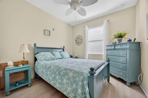 a bedroom with a bed and a dresser