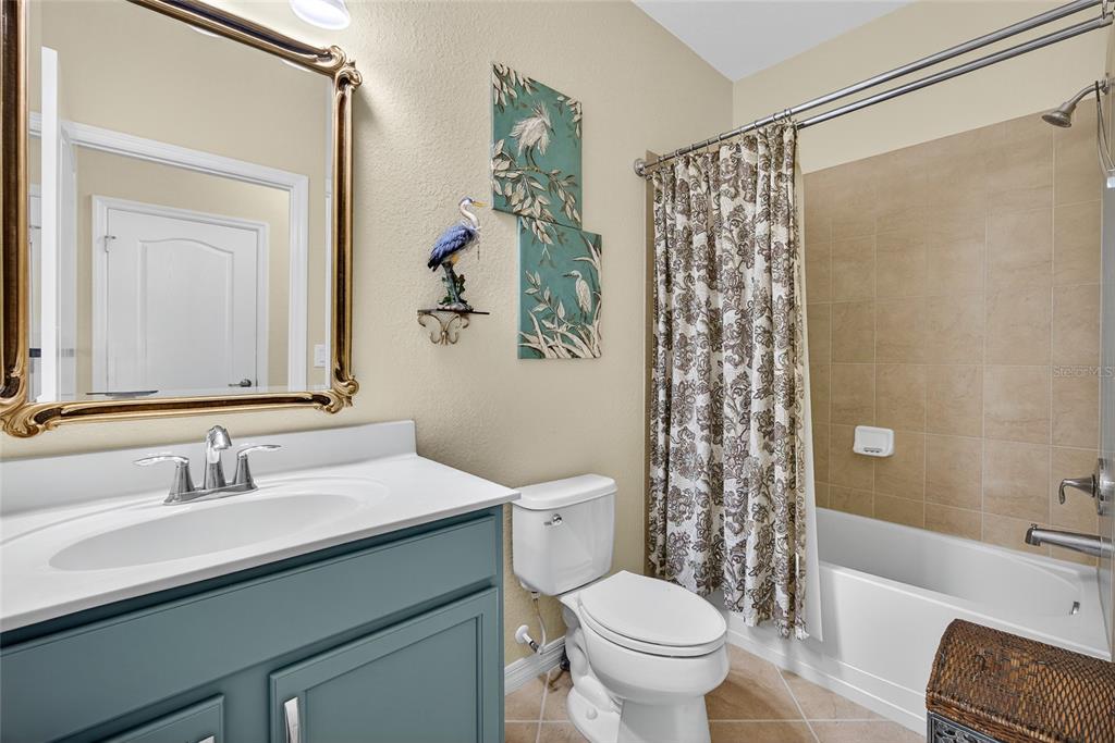 2877 Via Piazza Loop Fort Myers, FL 33905 - Photo 23 of 39 a bathroom with a sink toilet and shower