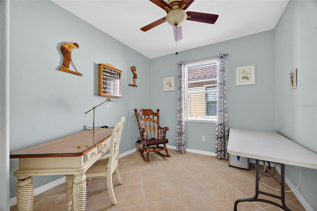 2877 Via Piazza Loop Fort Myers, FL 33905 - Photo 24 of 39 a view of a workspace with furniture and a window