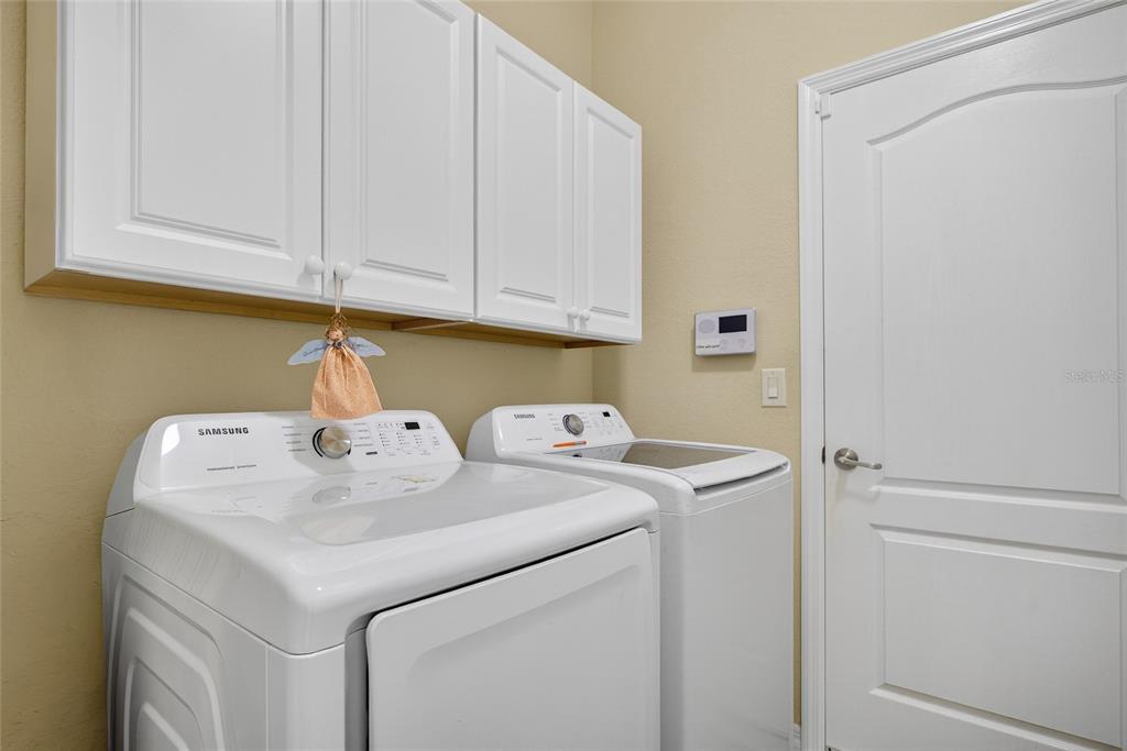 2877 Via Piazza Loop Fort Myers, FL 33905 - Photo 25 of 39 a utility room with dryer and washer