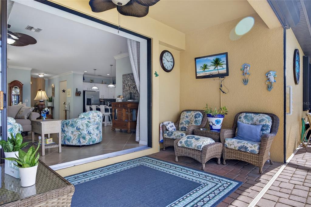 2877 Via Piazza Loop Fort Myers, FL 33905 - Photo 27 of 39 a living room with furniture and wooden floor