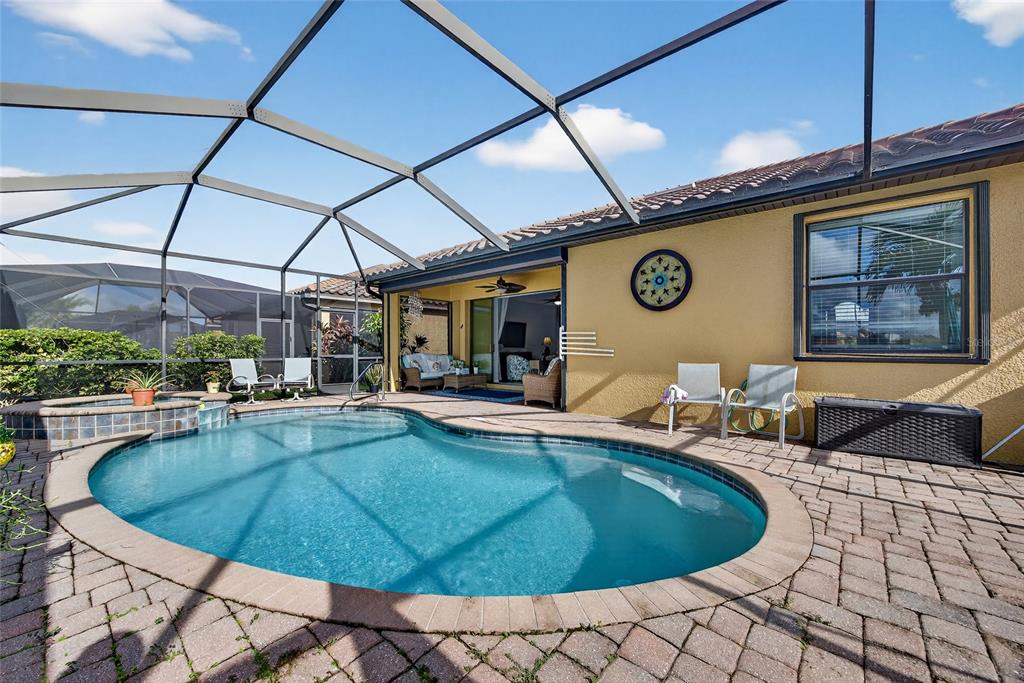2877 Via Piazza Loop Fort Myers, FL 33905 - Photo 29 of 39 a view of a swimming pool with outdoor seating